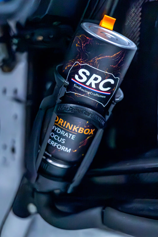 A close-up shot of an SRC Drinkbox hydration canister mounted in a black holder inside a race car, with the brand logo and 'Hydrate Focus Perform' text clearly visible.