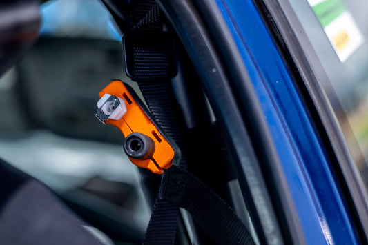 orange racing car hydration quick release holder mounted to roll bar