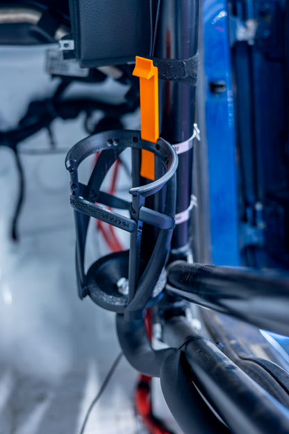close up of motorsport hydration bottle holder mounted on a race car roll cage.