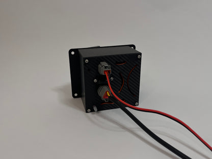rear of racing hydration unit laying on the side showing a black carbon fiber unit with 2 Deutsch connectors on the rear on a white background