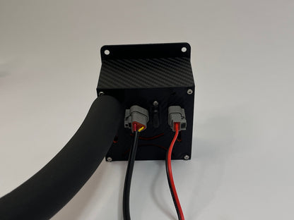 rear of racing drink unit showing a black carbon fiber unit with 2 Deutsch connectors on the rear with a black insulated tube on a white background