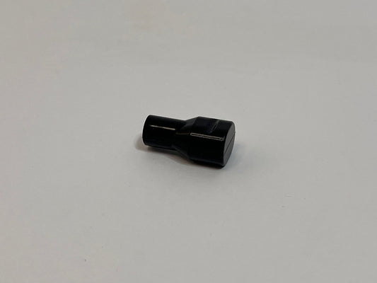 one black silicone bite valve on light gray background