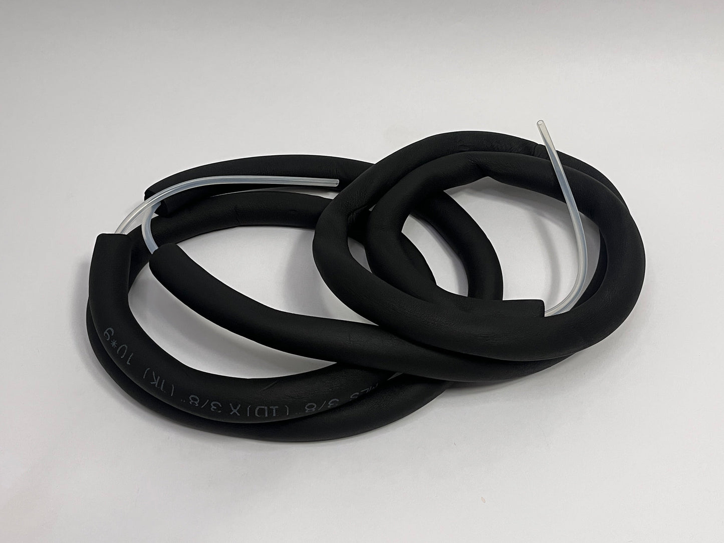 coiled 4 meter long silicone tubing with black insulation tubing on it showing ends with silicone tubing for race car hydration feeding