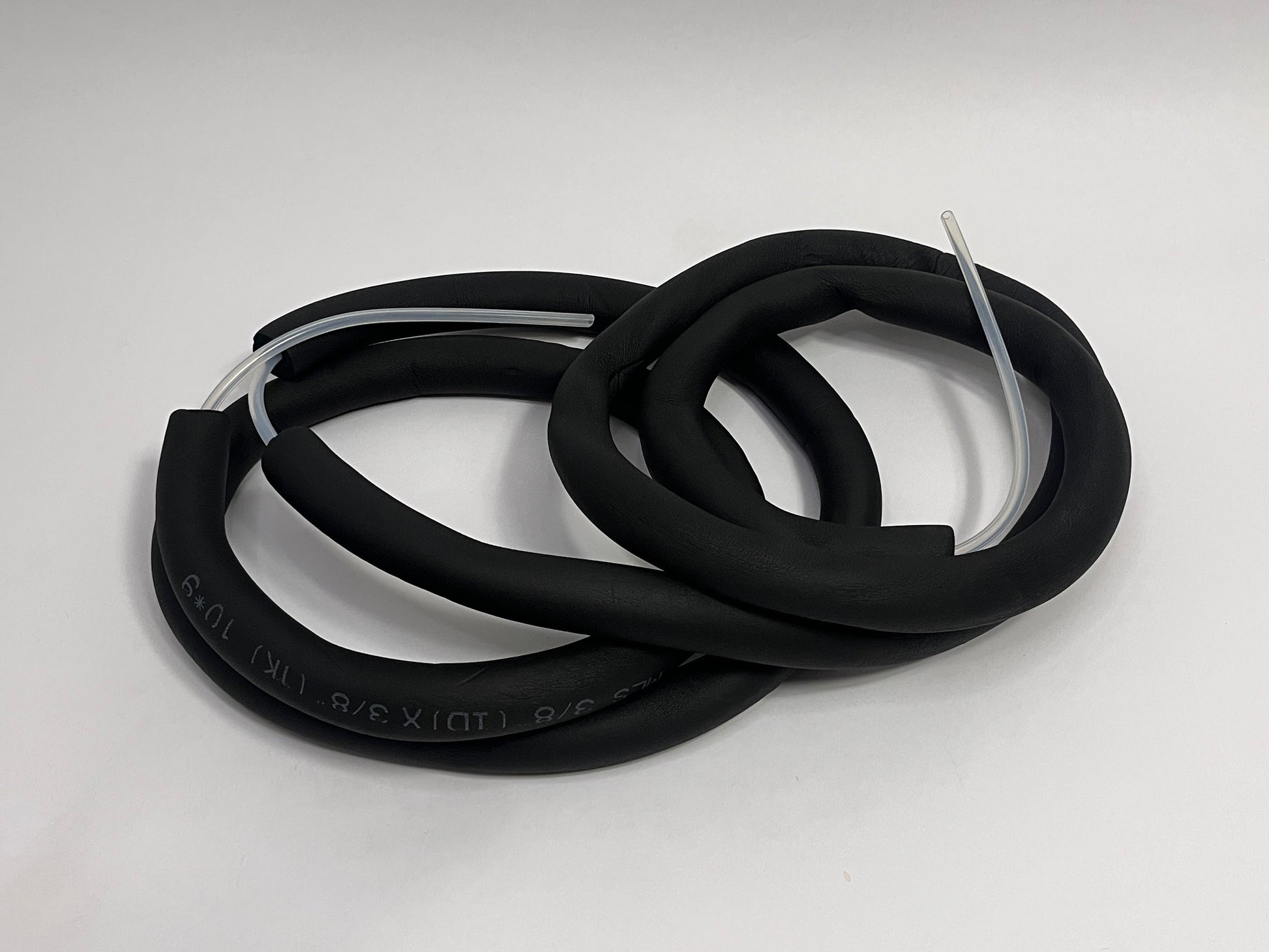 coiled 4 meter long silicone tubing with black insulation tubing on it showing ends with silicone tubing for race car hydration feeding