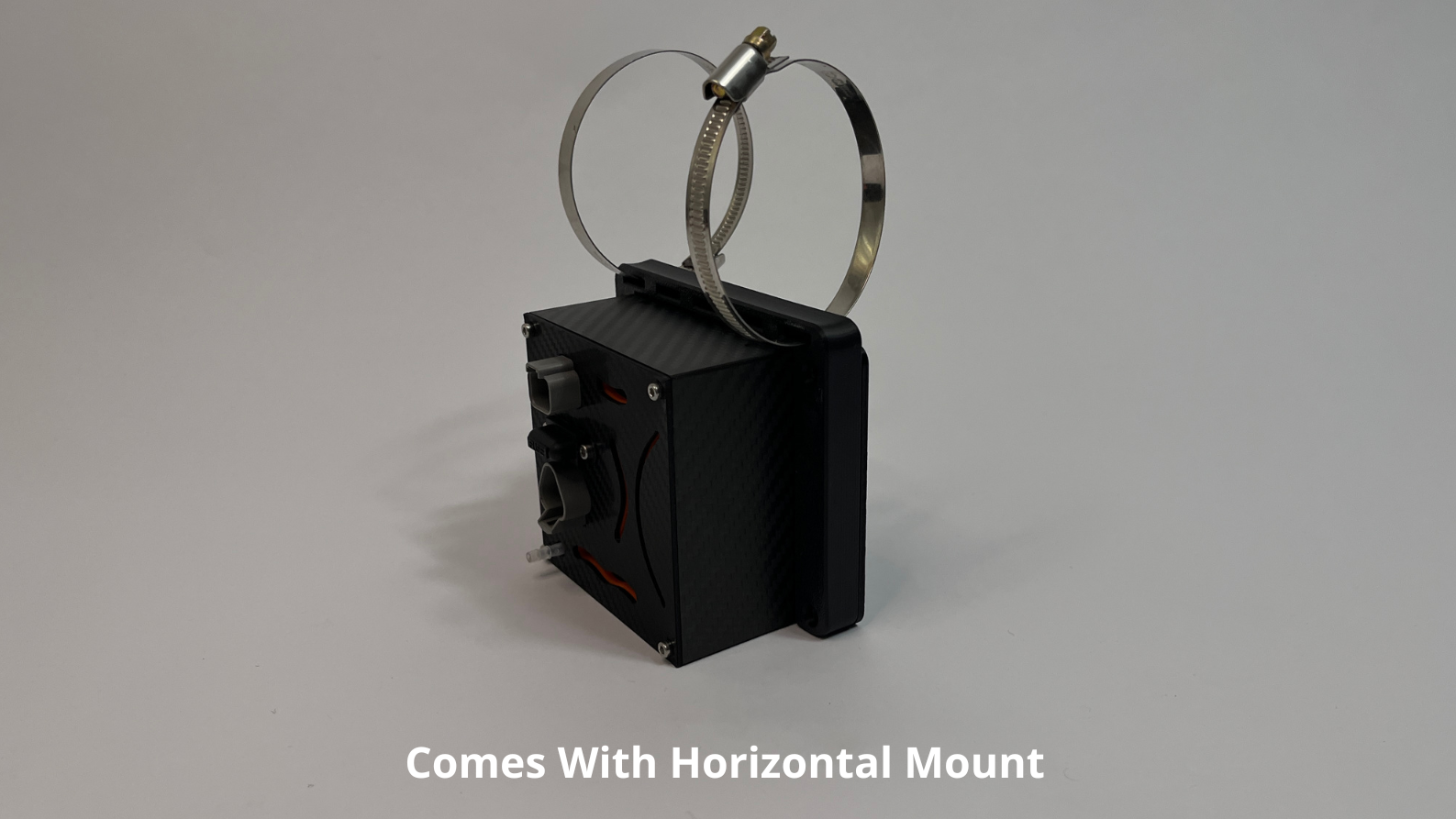 rear side of motorsport hydration pump unit showing a black carbon fiber unit with 2 Deutsch connectors on the rear with 2 roll cage mounts on the top to mount horizontally on a light gray background