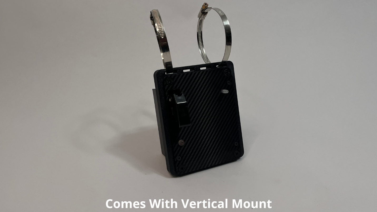 front side of motosport drink pump unit  showing a black carbon fiber unit with 2 Deutsch connectors on the rear with 2 roll cage mounts on the top to mount vertically on a light gray background