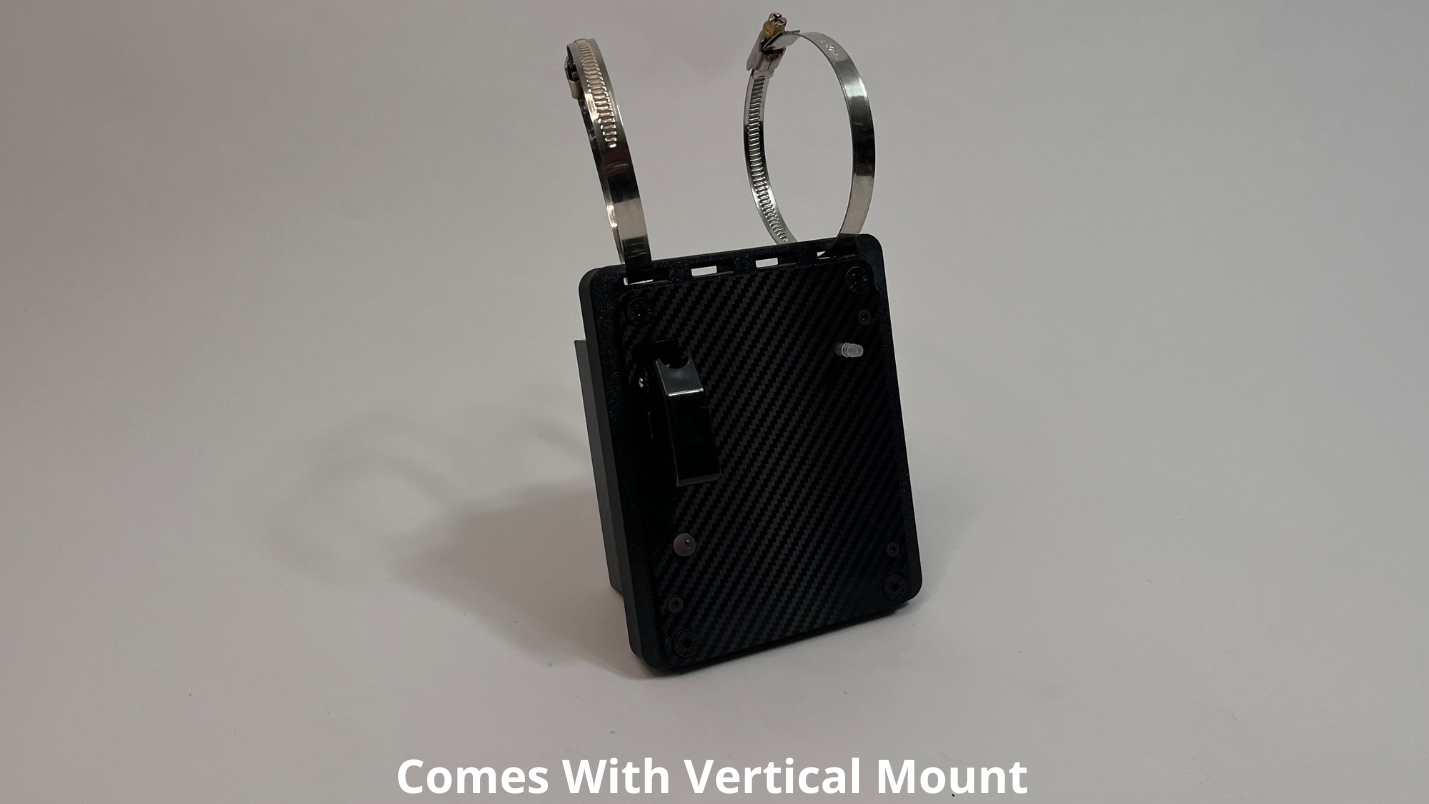 front side of motosport drink pump unit  showing a black carbon fiber unit with 2 Deutsch connectors on the rear with 2 roll cage mounts on the top to mount vertically on a light gray background